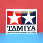 Tamiya 66748  Tamiya Logo Clear Coated Sticker (90mm x 115mm)